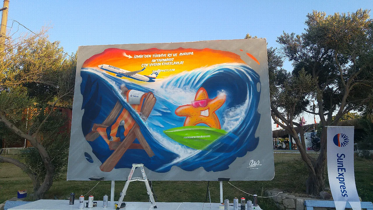 gün batımında denizde sörf yapan deniz yıldızı graffiti